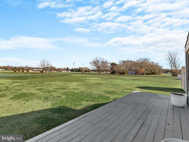 wooden deck with a lawn