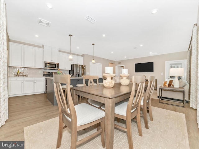 dining area featuring light hardwood / wood-style floors