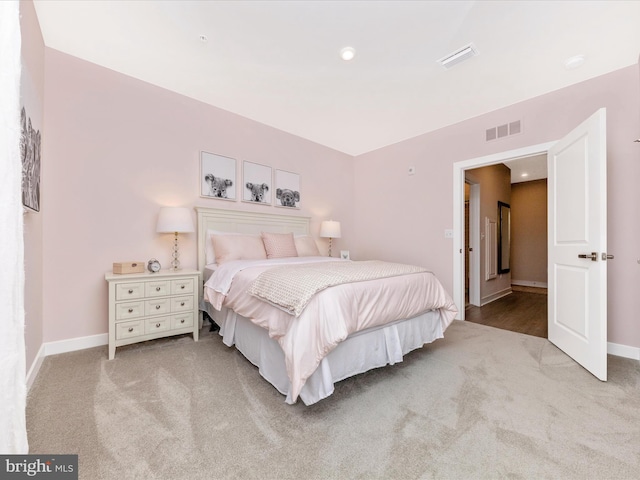 bedroom featuring light carpet