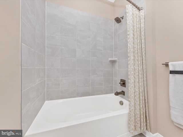 bathroom featuring shower / bath combination with curtain