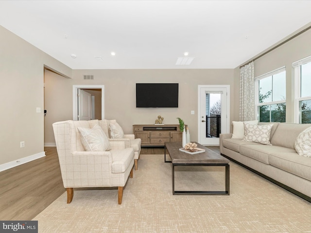 living room with light hardwood / wood-style flooring