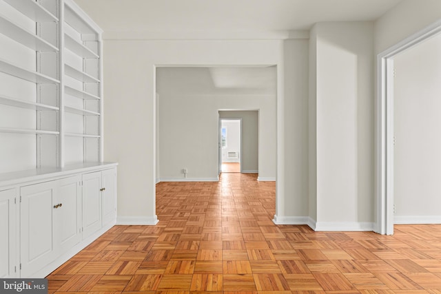 hallway featuring light parquet flooring