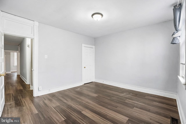 empty room featuring dark hardwood / wood-style floors