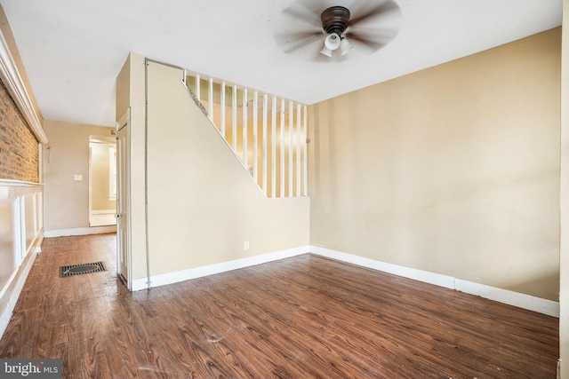 spare room with ceiling fan and hardwood / wood-style flooring