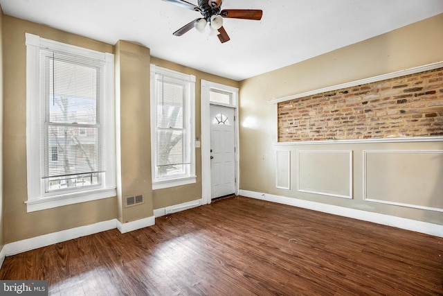 entrance foyer featuring ceiling fan and wood-type flooring