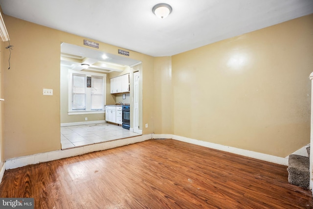 2348 Sidney Ave, Baltimore, MD 21230 - unfurnished living room featuring wood finished floors and baseboards