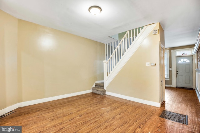 entrance foyer featuring hardwood / wood-style flooring