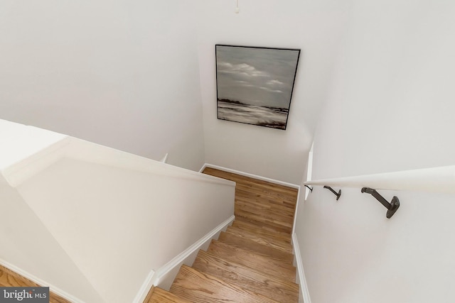 stairway featuring hardwood / wood-style floors