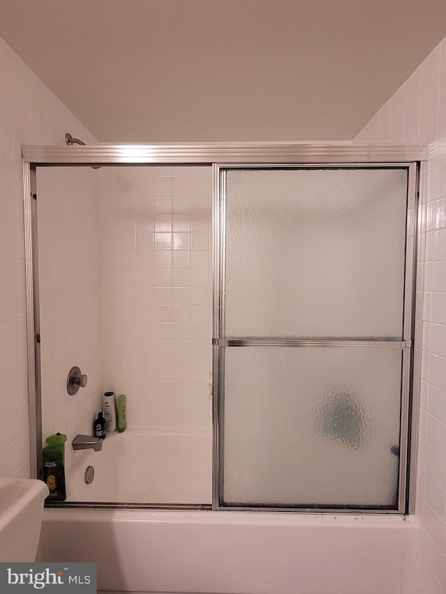 bathroom featuring enclosed tub / shower combo