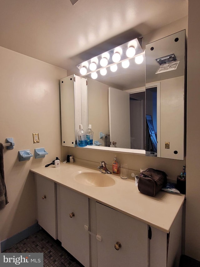 bathroom with vanity and tile patterned flooring