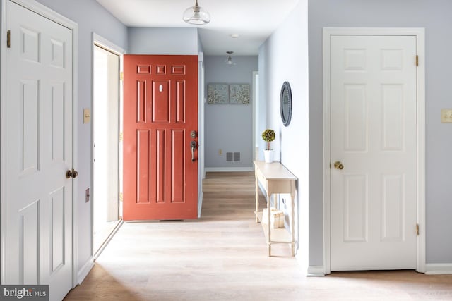 foyer with light hardwood / wood-style flooring