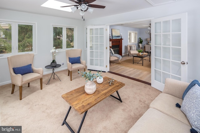 sunroom / solarium with ceiling fan and french doors