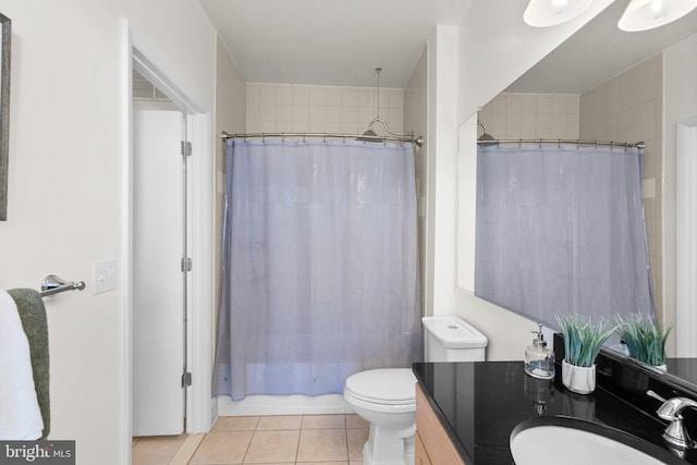 full bathroom featuring tile patterned floors, vanity, toilet, and shower / tub combo