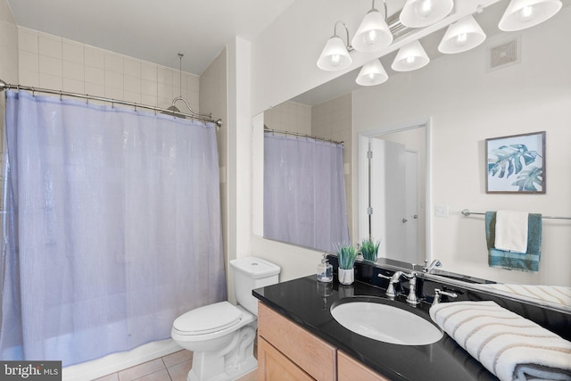 bathroom with tile patterned flooring, vanity, toilet, and a shower with curtain