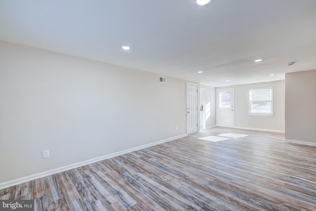 spare room featuring light hardwood / wood-style floors