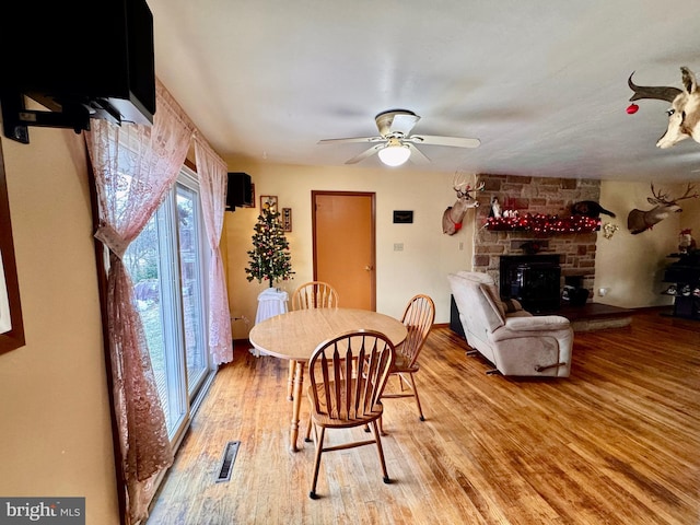 dining room featuring ceiling fan and hardwood / wood-style floors