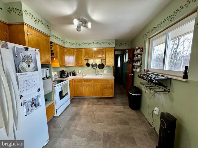 kitchen with sink and white appliances