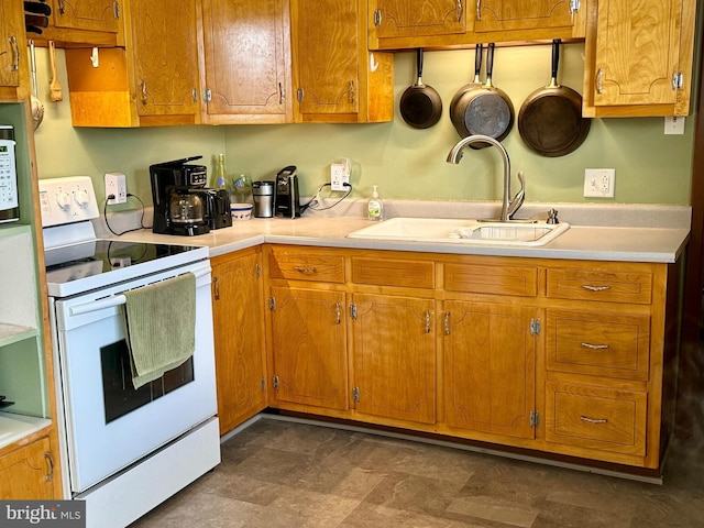 kitchen featuring sink and white electric stove