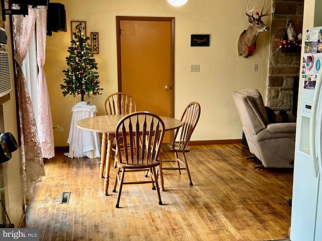 dining area featuring hardwood / wood-style floors