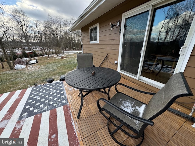 deck featuring a patio and a yard