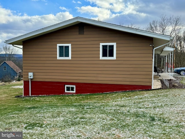 view of home's exterior featuring a lawn