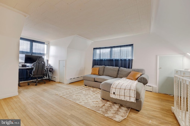 living room featuring lofted ceiling, light wood-type flooring, plenty of natural light, and ornamental molding