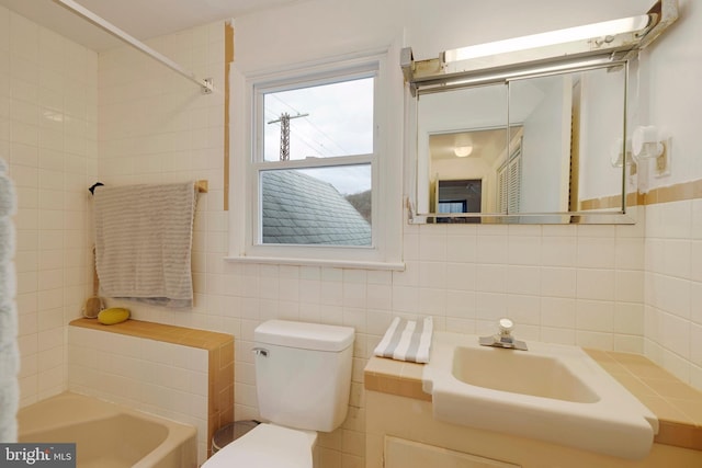 full bathroom with shower / bathtub combination, vanity, tile walls, and toilet