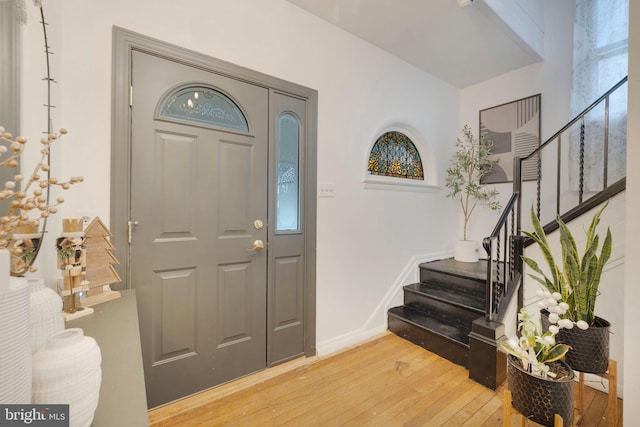 foyer entrance with hardwood / wood-style floors