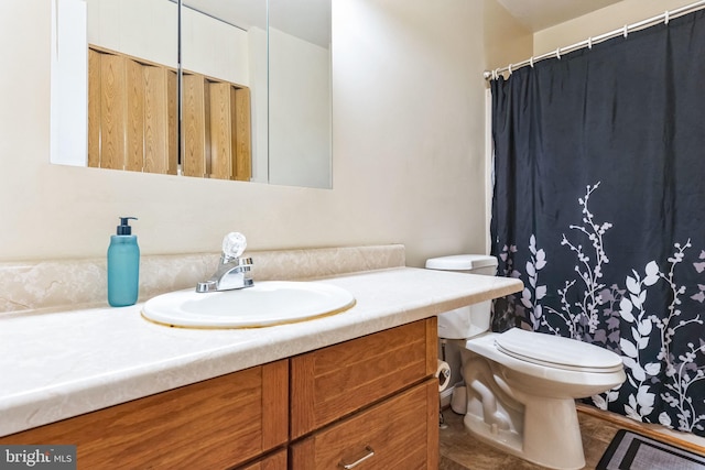 bathroom featuring vanity and toilet