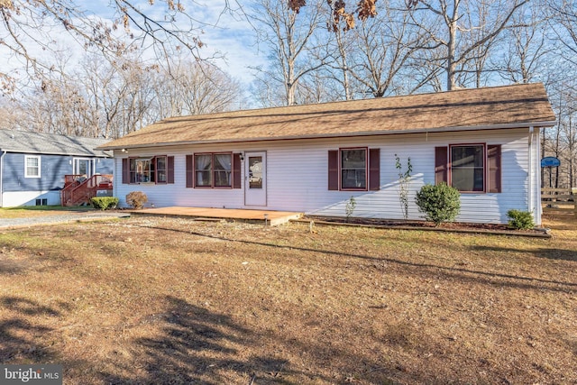 ranch-style house with a front yard