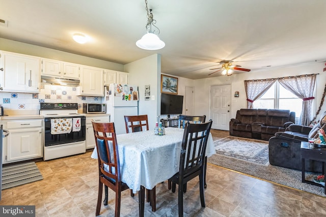 dining space with ceiling fan