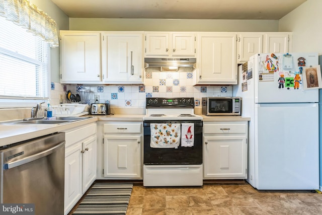 kitchen featuring decorative backsplash, sink, white cabinetry, and stainless steel appliances