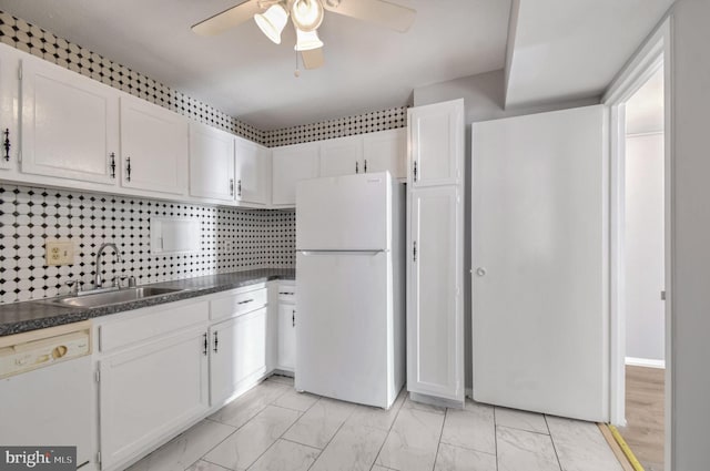 kitchen featuring white cabinetry, white appliances, and sink