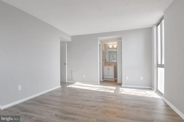 empty room with light wood-type flooring