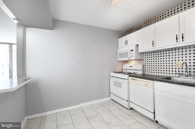 kitchen featuring white appliances, sink, decorative backsplash, and white cabinets