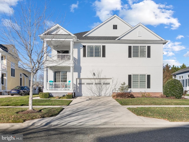 view of front facade with a front lawn and a garage