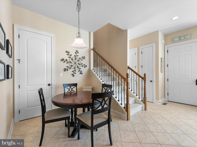 dining room with light tile patterned flooring