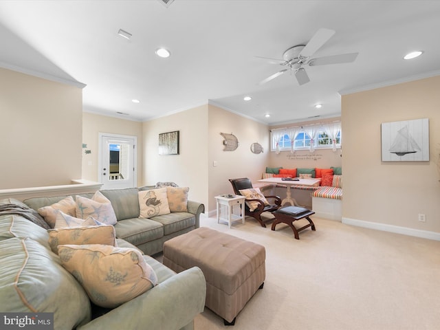 carpeted living room with ceiling fan and crown molding