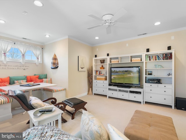 carpeted living room featuring breakfast area, ceiling fan, and ornamental molding