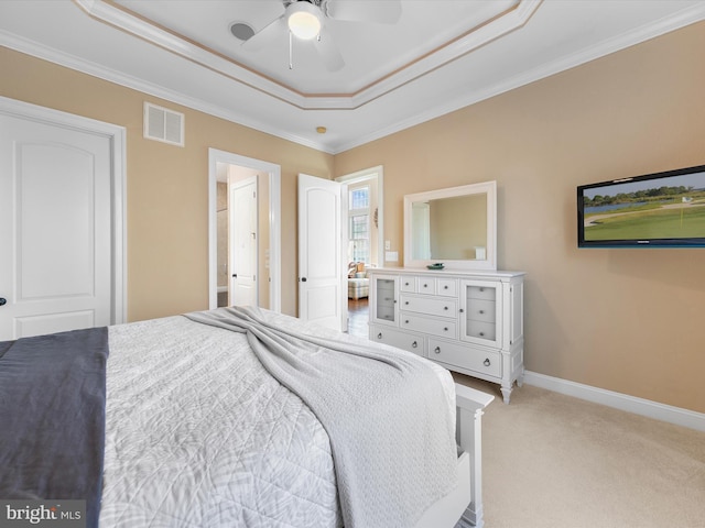 carpeted bedroom featuring a raised ceiling, ceiling fan, and crown molding