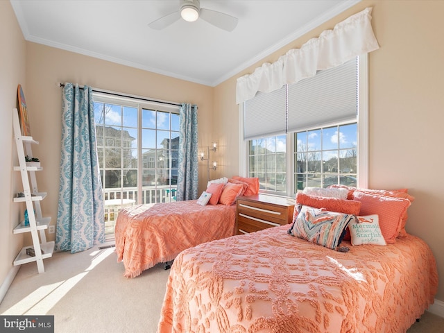 carpeted bedroom with ceiling fan and crown molding