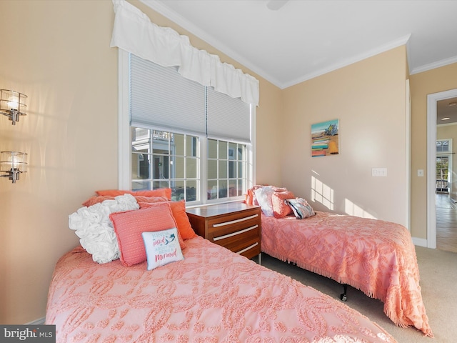 carpeted bedroom featuring crown molding