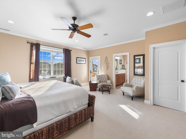 carpeted bedroom with ensuite bath, ceiling fan, and ornamental molding