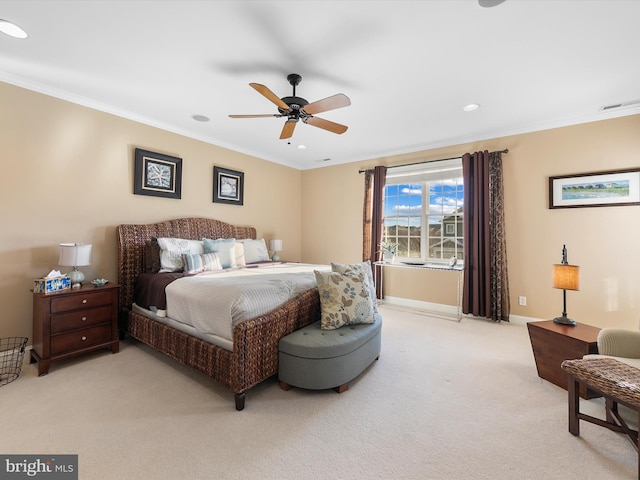 bedroom featuring ceiling fan, crown molding, and light carpet