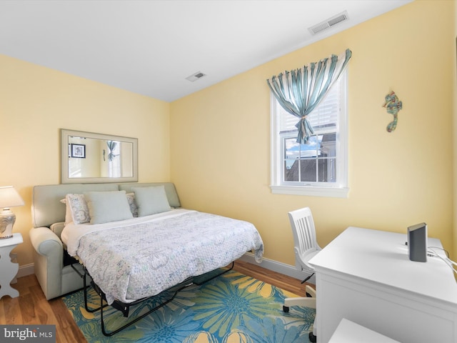 bedroom featuring hardwood / wood-style floors