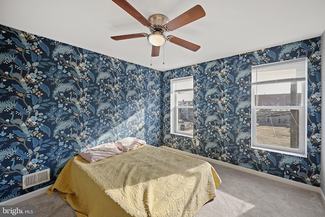 bedroom featuring ceiling fan and carpet floors