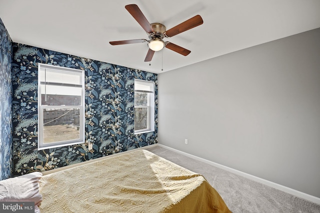 unfurnished bedroom with carpet flooring and ceiling fan