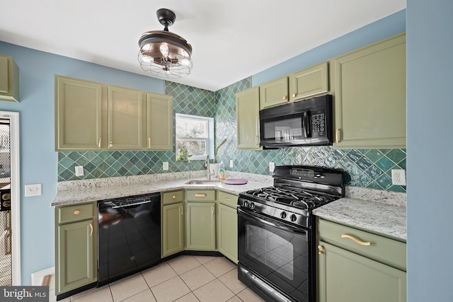 kitchen featuring black appliances, sink, light tile patterned floors, decorative light fixtures, and light stone counters