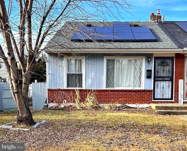 view of front of home with solar panels