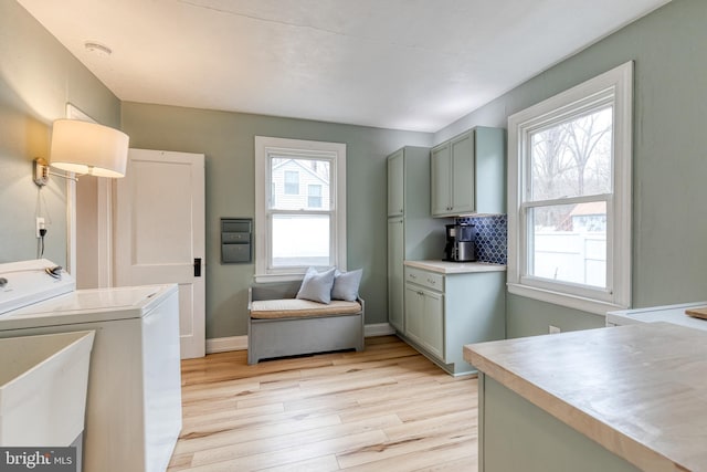 washroom featuring light hardwood / wood-style floors and sink